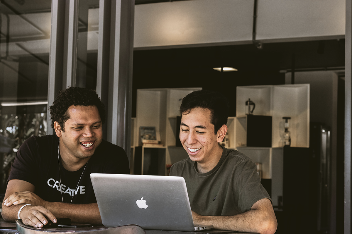 Two developers working at a table.